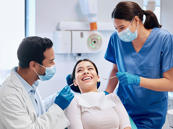 Family dental care at Murias Dental with adult patient receiving a professional exam and cleaning